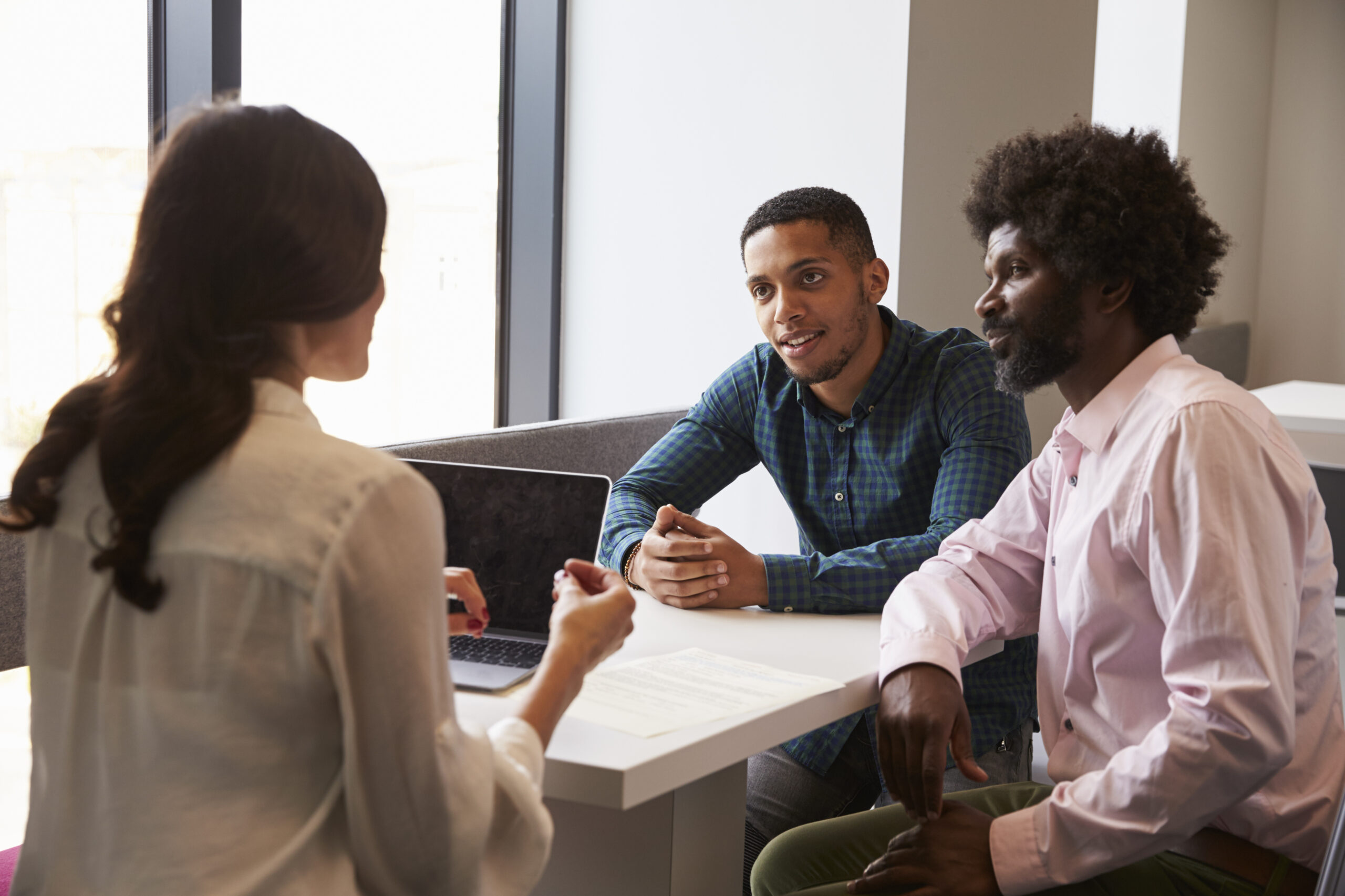 Father And Son Meeting With Female Teacher Onsite Support